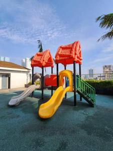 a playground with three slides and a slideintend at CitiBay View Staycation in Manila