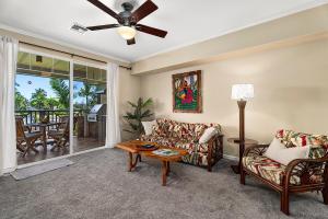 a living room with a couch and a table at Waikoloa Beach Villas F22 condo in Waikoloa