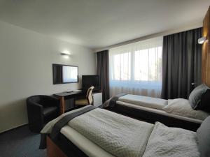 Posteľ alebo postele v izbe v ubytovaní Hotel P7