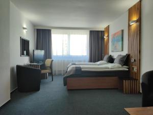 Posteľ alebo postele v izbe v ubytovaní Hotel P7