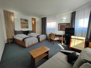 Posteľ alebo postele v izbe v ubytovaní Hotel P7