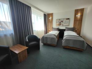 Posteľ alebo postele v izbe v ubytovaní Hotel P7