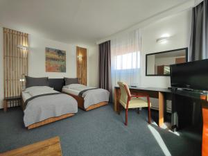 Posteľ alebo postele v izbe v ubytovaní Hotel P7