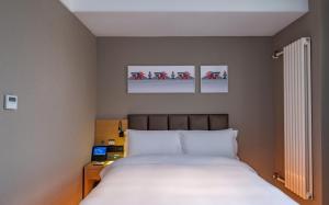 Voodi või voodid majutusasutuse True Go Hotel - Beijing Asian Games Village National Convention Center toas