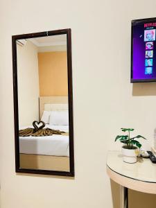 Voodi või voodid majutusasutuse Ayuri Hotel Malioboro toas