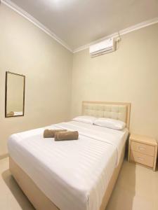 Voodi või voodid majutusasutuse Ayuri Hotel Malioboro toas