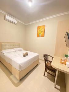 Voodi või voodid majutusasutuse Ayuri Hotel Malioboro toas