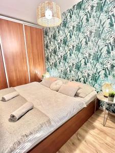 A bed or beds in a room at URBAN JUNGLE Apartment old town Air Conditioned