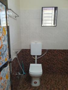Ванная комната в SWAMI HOMESTAY