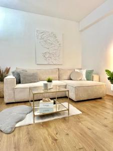 a living room with a couch and a table at URBAN JUNGLE Apartment old town Air Conditioned in Bratislava