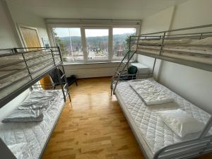 Postel nebo postele na pokoji v ubytování Hestra Guesthouse
