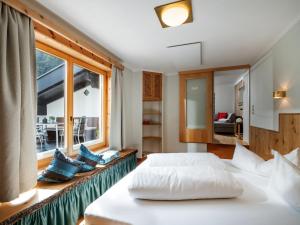 Un pat sau paturi într-o cameră la Appartement Andrea Hauser - Riedltischler