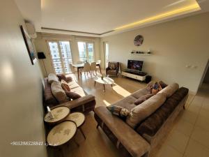 a living room with two couches and a table at Apartment in Bursa - Turkey in Bursa