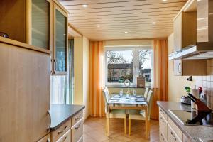 a small kitchen with a table and a window at Haus Zum Rochusberg 2 in Bingen am Rhein