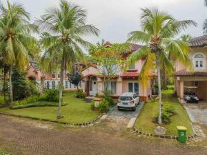 an aerial view of a house with palm trees at LaGita Carita Villa in Pandegelang