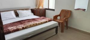 Postel nebo postele na pokoji v ubytování Hotel Manasvi Palace