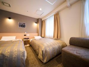 Postel nebo postele na pokoji v ubytování Kyoto Daiichi Hotel + 37 fotografií
