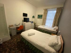 Postel nebo postele na pokoji v ubytování Aaran Central Guesthouse