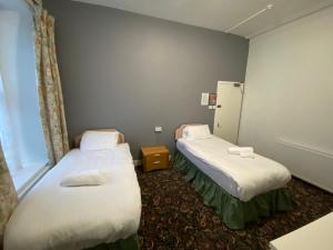 Postel nebo postele na pokoji v ubytování Aaran Central Guesthouse