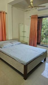 En eller flere senge i et værelse på Om Nanaai Villa