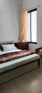 Postel nebo postele na pokoji v ubytování Hotel Manasvi Palace