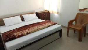 Postel nebo postele na pokoji v ubytování Hotel Manasvi Palace
