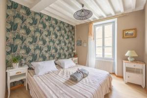 Llit o llits en una habitació de La Parenthèse Côtière - Moins d’un km de la plage