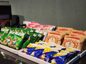 a table topped with lots of different types of food at Fun Stay Inn Ximen in Taipei