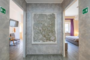 Postel nebo postele na pokoji v ubytování RomAntica Vatican Suites