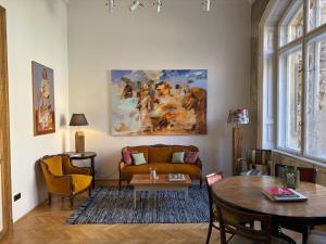 a living room with a couch and a table at Brody House - boutique hotel in Budapest