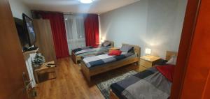 Postel nebo postele na pokoji v ubytování Apartament Sosnowiec + 4 fotografie