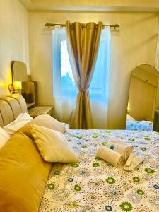 Katil atau katil-katil dalam bilik di SMDC HOPE RESIDENCES (Pecho Perfect Suite)