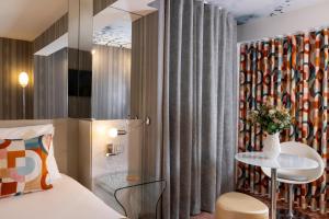 Le 7 Eiffel Hotel by Malone客房内的一张或多张床位