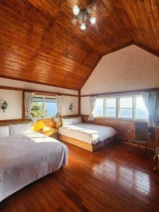 A bed or beds in a room at Zu Sin Garden B&B