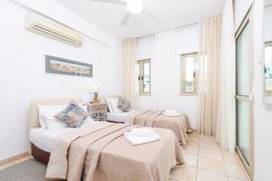 Ένα ή περισσότερα κρεβάτια σε δωμάτιο στο Sunrise Bay Villa #3