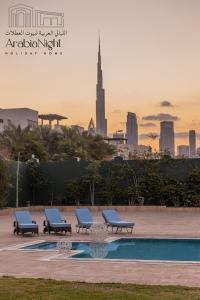 Het zwembad bij of vlak bij Arabian Nights - Exclusive Villa With Private Pool in Al Hamra Palace