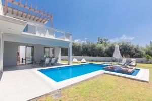 a villa with a swimming pool and a patio at Napa Sunlight Villa #2 in Ayia Napa