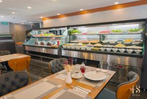 a restaurant with a table and a buffet of food at FOUR SEVEN HOTEL in Istanbul