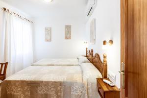 Łóżko lub łóżka w pokoju w obiekcie Villa Terra