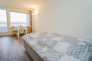 Ένα ή περισσότερα κρεβάτια σε δωμάτιο στο Haus Sylter Welle 9-92 WB