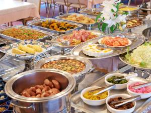 a buffet filled with many different types of food at Gamagori Hotel in Gamagōri