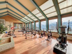 a gym with a bunch of exercise bikes in a room at Apartment Mondzeu D034 in Verbier