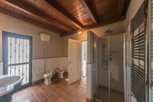a bathroom with a toilet and a sink and a shower at Sui tetti di Trani Harbour suite in Trani +21 photos