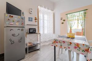 TV a/nebo společenská místnost v ubytování Casetta Holiday Meli