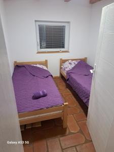 Postel nebo postele na pokoji v ubytování Etno selo EKO POGLEDI