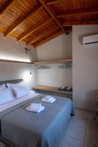 Posteľ alebo postele v izbe v ubytovaní Avres Apartments
