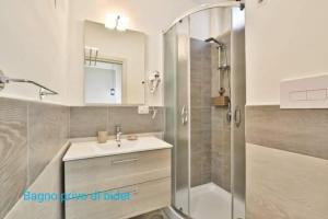 a bathroom with a sink and a shower at B&B Iris in Santa Maria di Castellabate