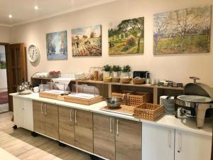 a kitchen with a counter with many items on it at Landhaus Fillerberg in Wildeshausen