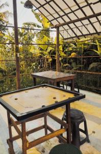 a ping pong table sitting on a patio at Oryza wayanad in Kalpetta