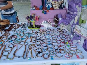 a table with a bunch of jewelry on it at Senkini Dvori in Sutomišćica